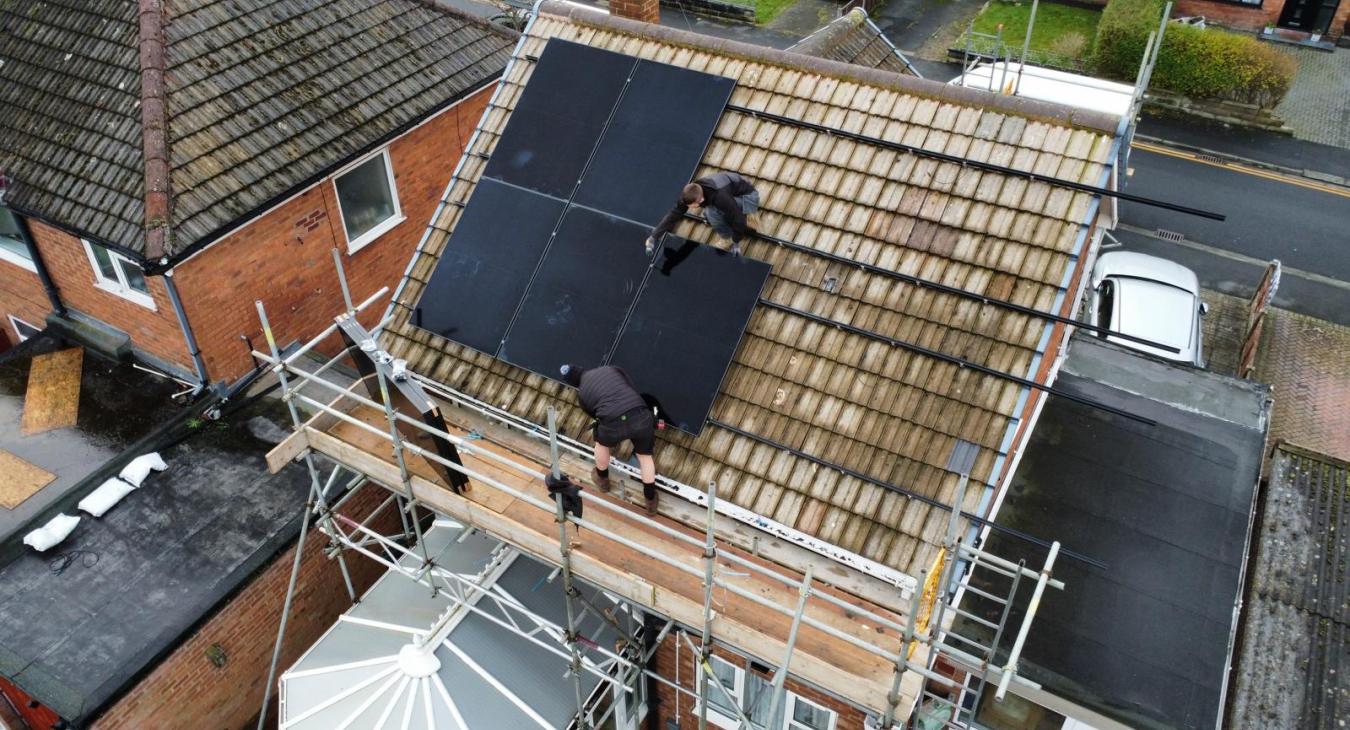 West Coast Electricals' electricians installing solar panels on a roof in Blackpool - How Much Can You Save With Solar Panels in Blackpool? 